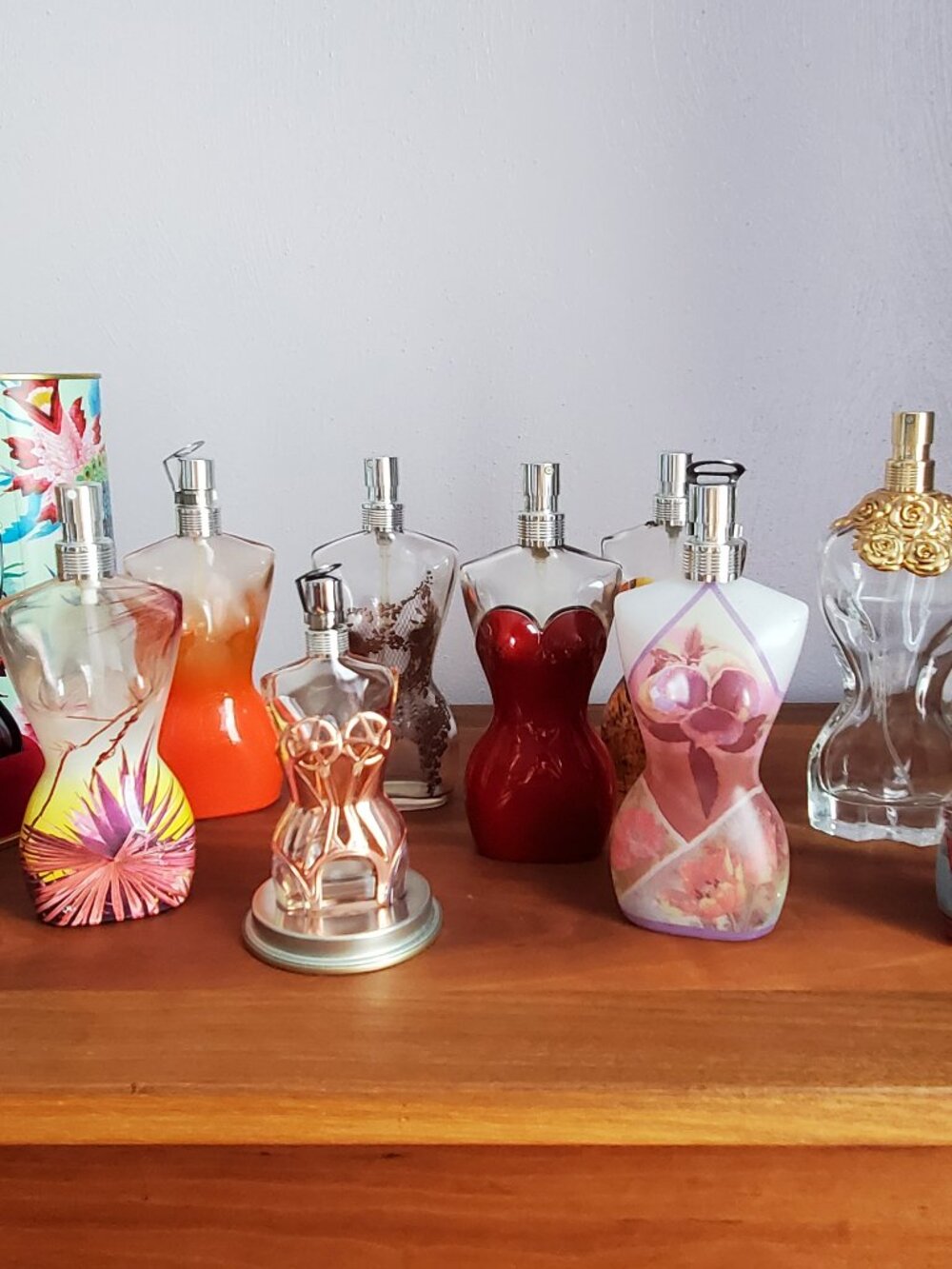 Lot of 11 empty Jean-Paul Gaultier La Belle collector editions perfume bottles.